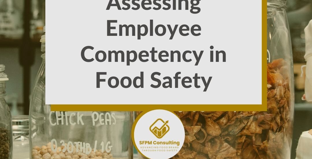 A sign titled "Assessing Employee Competency in Food Safety" is displayed on a counter with food jars in a laboratory, highlighting the importance of food safety training and fostering a strong food safety culture.